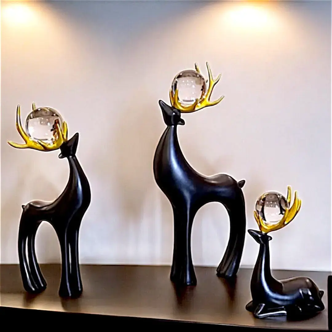 Deer figurine set of 3 on brown table